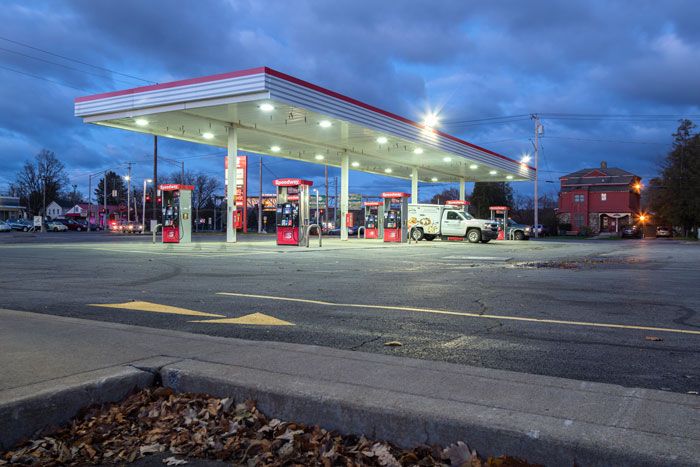 A Speedway station store lit up at night.