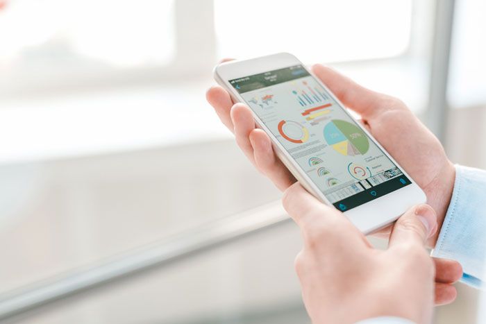 A business owner reviews the data on their fleet card app.