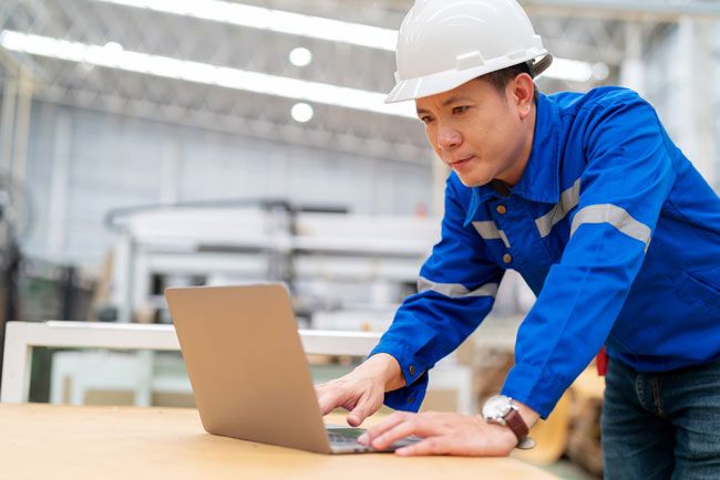 A business owner is able to check on his fleet from his laptop and get real-time data on fuel usage thanks to telematics.