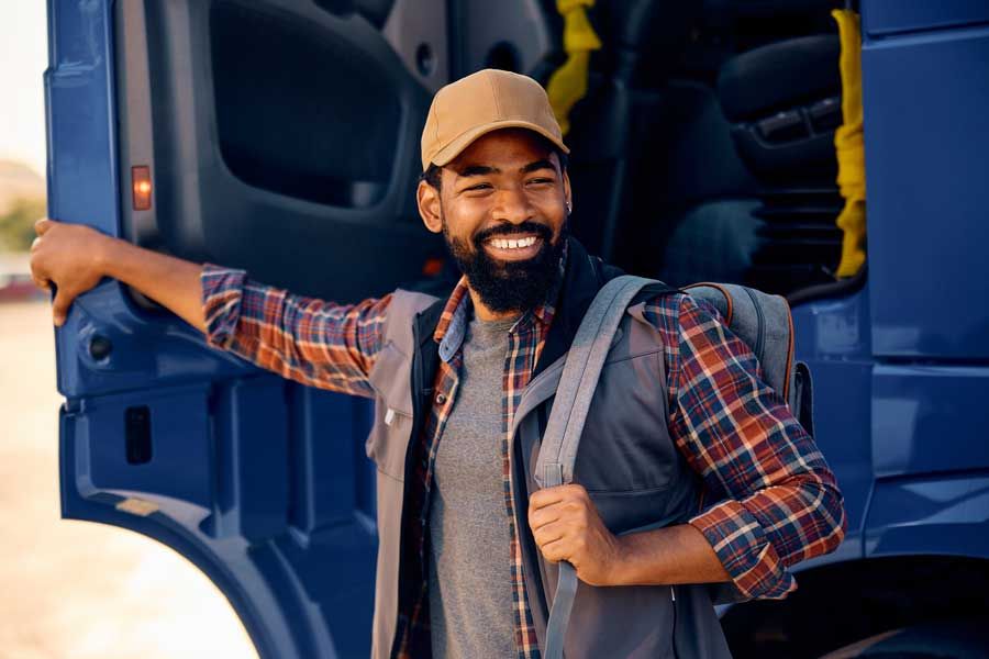 A truck driver prepares for his work day on his fleet route.